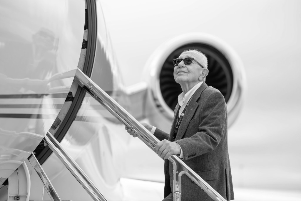 Elie Zelouf standing outside of aircraft